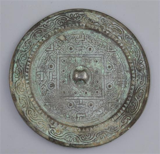 A Chinese bronze circular TLV mirror, Han dynasty, 1st century B.C., 13.5cm diameter, small filled hole